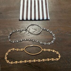Henri Bendel gold and silver jeweled headbands.
